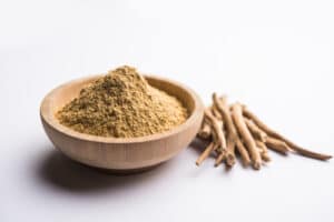 Stems and a bowl of powdered ashwagandha- a calming food to consume. 