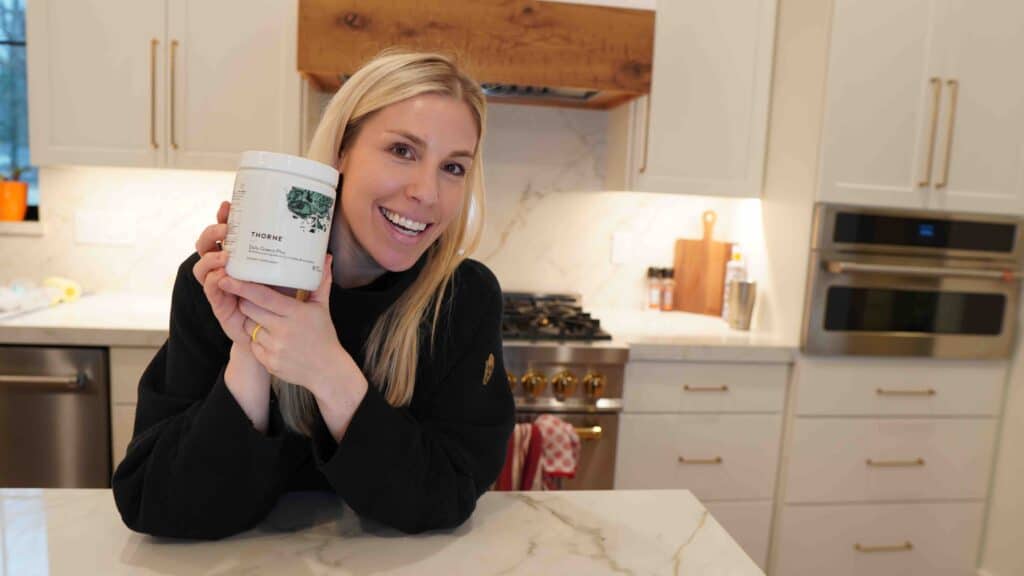 Kylene holding the best greens powder supplement - Daily Greens Plus by Thorne