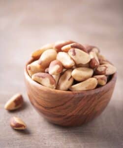 Bowl of Brazil nuts for a protein snack. Brazil nuts are a great nut and one of the best nuts for athletes.