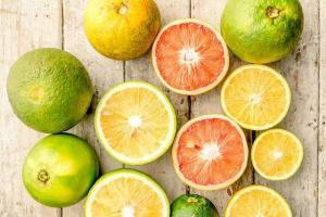 Collection of citrus fruits with some cut in half which may be consumed to help reduce stress.