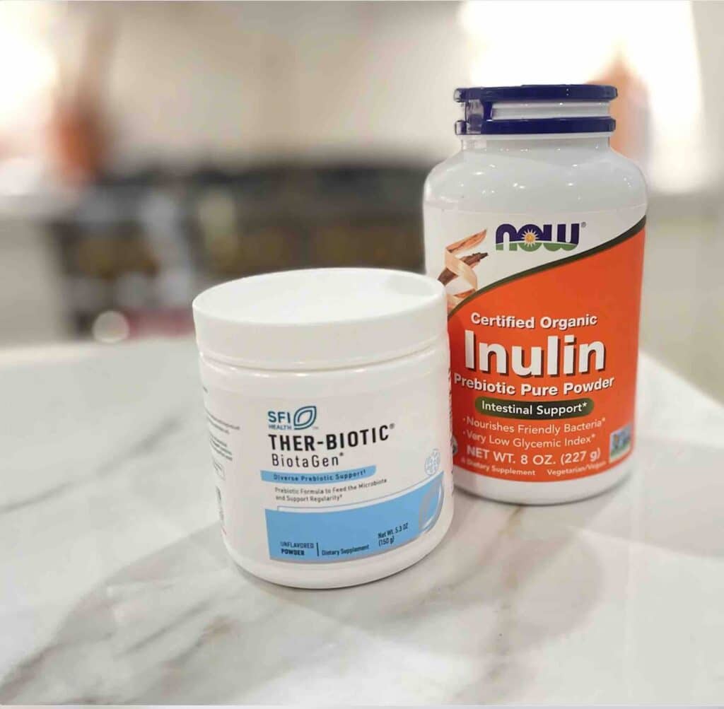 Picture of 2 prebiotic supplements to help increase the benefit of taking probiotics. This picture shows Ther-Biotic Biotagen by SFI and Organic Inulin by NOW Nutrition. 