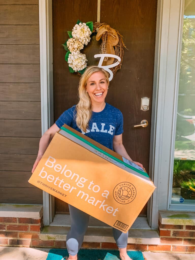 Kylene Bogden holding a box of Thrive Market products