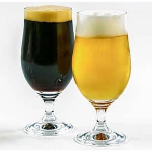 Two glasses of beer which contains alcohol and may contribute to leaky gut syndrome. 