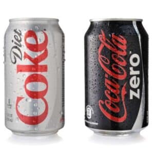 A can of diet Coke and Coca Cola Zero which are a leaky gut food to avoid due to artificial sweeteners
