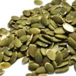 A pile of pumpkin seeds which are one of the tastiest options on the protein in seeds chart